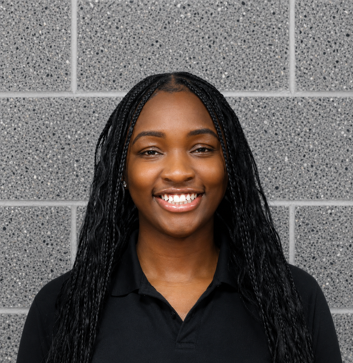 Maimuna Kenneh smiling in a black collared shirt